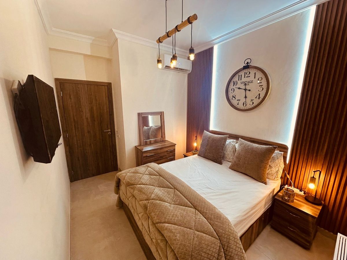 Photo de Appartement moderne à 5min de l’aéroport 